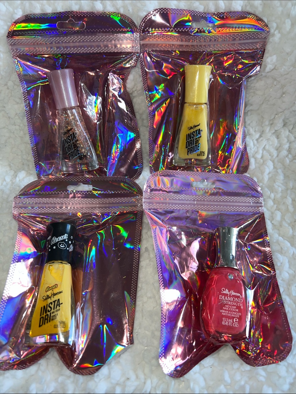 Sally Hansen Nail Polish – Yellow, Pink, Pink glitter & Fuchsia.